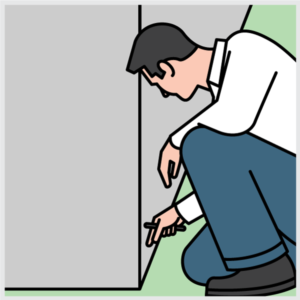 Inspect For Active Termites Image of a pest control technician inspecting for termites.